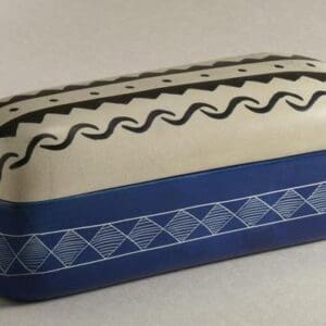 A decorative rectangular box with patterned designs in blue and black.