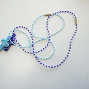 blue and white cross necklace