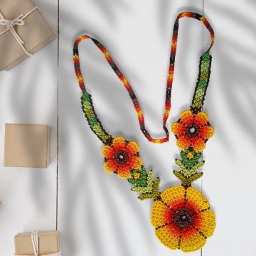 handcrafted necklace with yellow and orange flower design