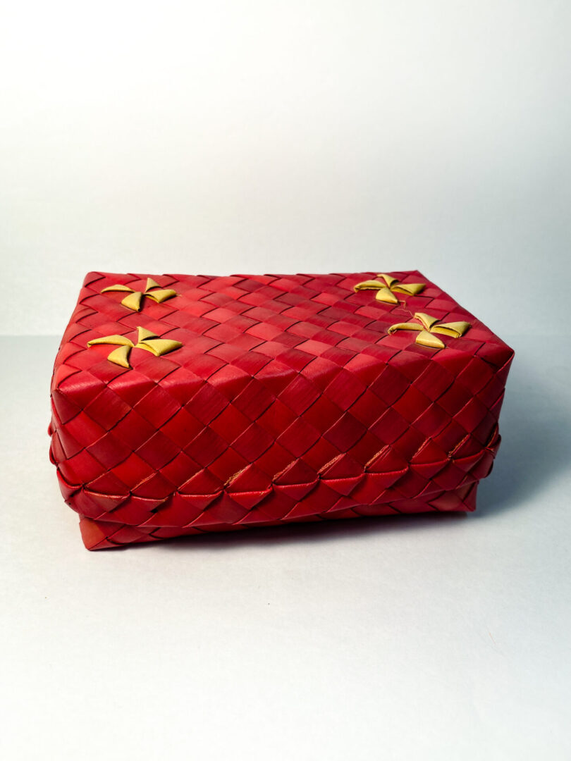 A Red Color Box With Yellow Flower Pattern