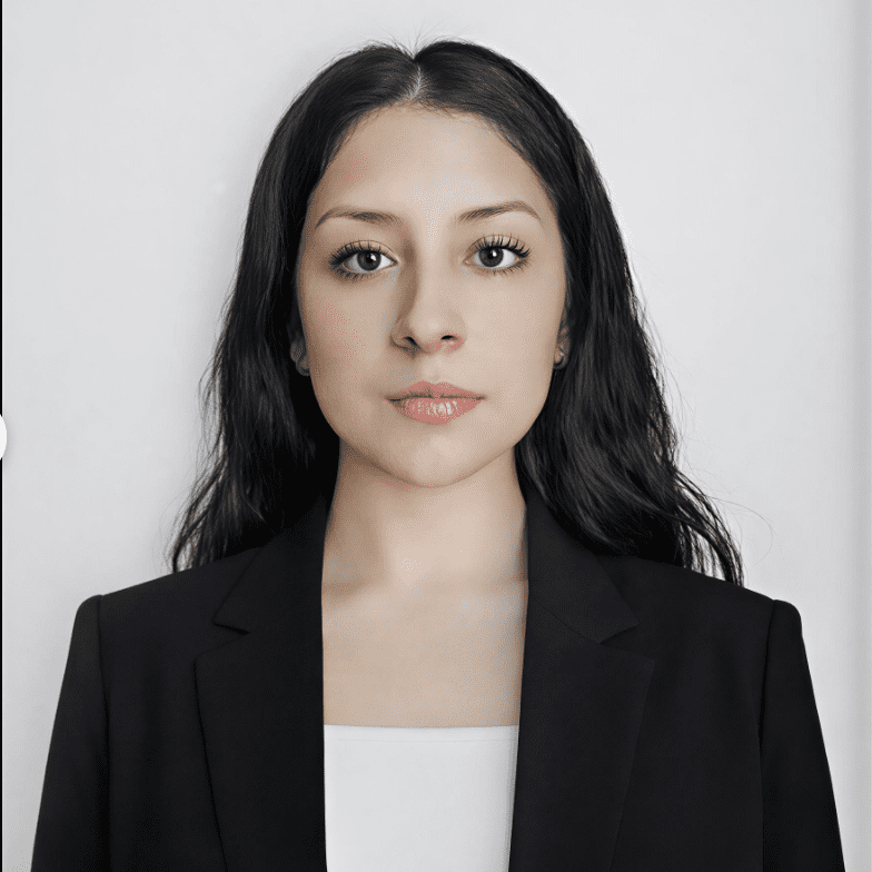 Professional woman with long dark hair in a black blazer.